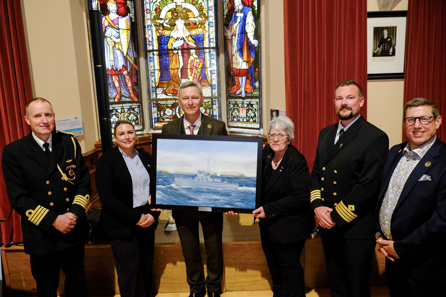 From the left: Defence Attaché Pål Hope, Project Manager Ragnhild Bie, Ambassador Tore Hattrem, Convenor Andrea Mason, Department Manager at D/S Hestmanden Hallvard Klungtveit and General Manager of the Norwegian-British Chamber of Commerce Kyrre Haugen during the presentation of gifts between the nations - Photo: Bob Kerr