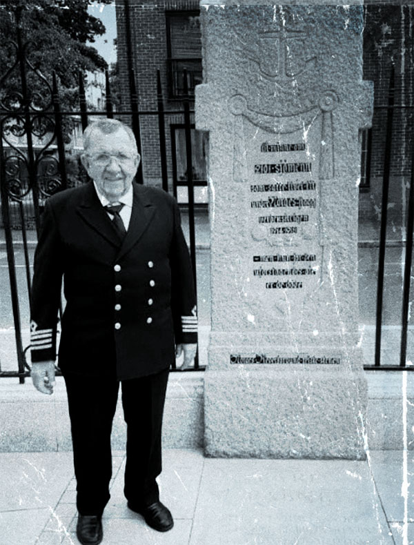 Wiktor in front of the memorial at the Norwegian Church in St Olav’s Place